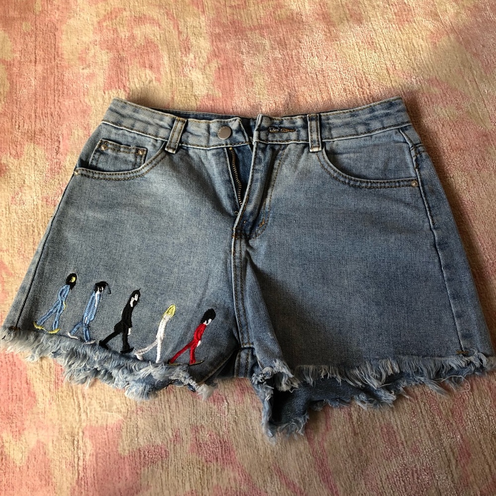 Denim shorts embroidered with Beatles figures